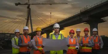 Construction workers celebrating new infrastructure bill approval